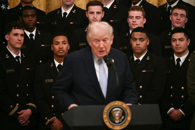 US President Donald Trump speaks during a ceremony to present the Commander-in-Chief Trophy to the Navy Midshipmen football team of the United States Naval Academy in the East Room of the White House in Washington, DC, on March 20, 2026. (Photo by Brendan SMIALOWSKI / AFP)