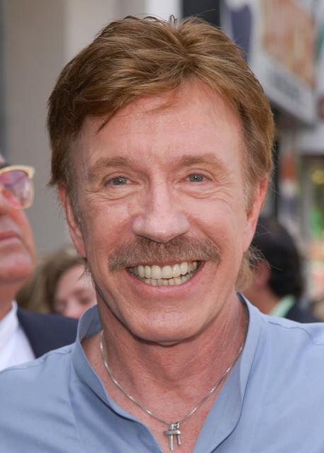 (FILES) This picture taken on August 27, 2002 shows US actor Chuck Norris attending Michael Bolton’s  Hollywood Walk of Fame star ceremony in Hollywood, California. Chuck Norris, the US martial artist and Hollywood action star most famous for his role in "Walker, Texas Ranger," has died, his family said on March 20, 2026. He was 86. (Photo by Chris DELMAS / AFP)