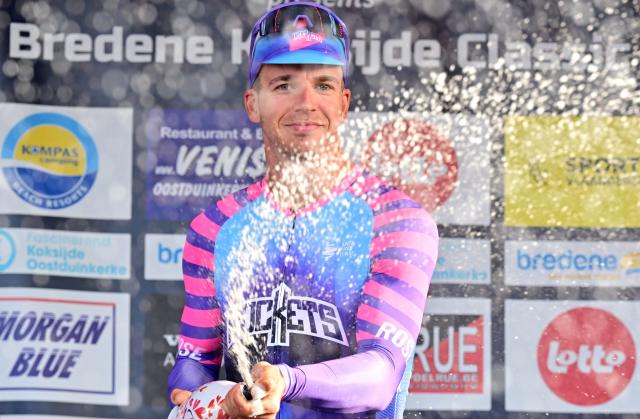 Unibet Rose Rockets' Dutch rider Dylan Groenewegen celebrates on the podium after winning the 'Bredene Koksijde Classic' one day cycling race, 203.4 km from Bredene to Koksijde, on March 20, 2026. (Photo by DIRK WAEM / Belga / AFP) / Belgium OUT