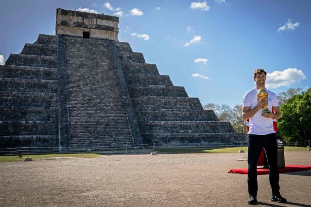 Spain’s ex national team footballer and part of their World Cup winning team in 2010, Fernando Llorente, holds the World Cup trophy in Chichen Itza, Yucatan state on March 20, 2026. The World Cup trophy was presented at the world famous Mayan landmark, one of the seven modern wonders of the world, as part of a country-wide tour ahead of the upcoming 2026 World Cup football tournament to be held in Mexico, Canada and the United States. (Photo by Carl de Souza / AFP)