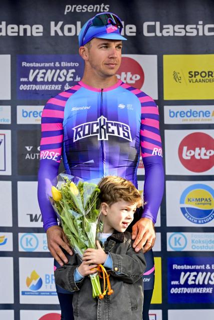 Unibet Rose Rockets' Dutch rider Dylan Groenewegen celebrates on the podium after winning the 'Bredene Koksijde Classic' one day cycling race, 203.4 km from Bredene to Koksijde, on March 20, 2026. (Photo by DIRK WAEM / Belga / AFP) / Belgium OUT