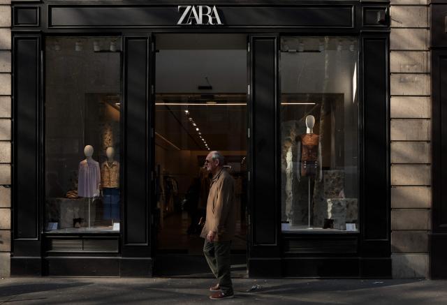 A pedestrian walks past a store of Spanish clothing retailer Zara in Paris on March 20, 2026. (Photo by Charlotte SIEMON / AFP)