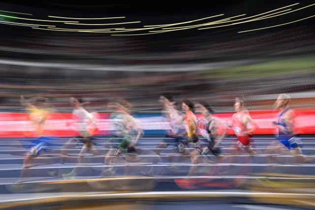 Athletes compete in the men's 1500 metres heat 2 during the World Athletics Indoor Championships Kujawy Pomorze 2026 in Torun, Poland on March 20, 2026. (Photo by Kirill KUDRYAVTSEV / AFP)
