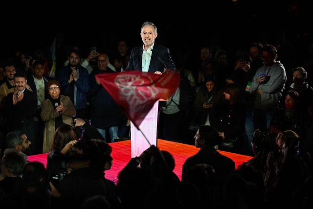 French Socialist Party (PS) Member of Parliament and left wing candidate for the Paris city hall Emmanuel Gregoire delivers a speech during a campaign rally ahead of the second round of France's 2026 municipal elections, at the Belleville Park in Paris on March 20, 2026. French voters head to the polls on March 22, 2026, for the second round of municipal elections. (Photo by JULIEN DE ROSA / AFP)