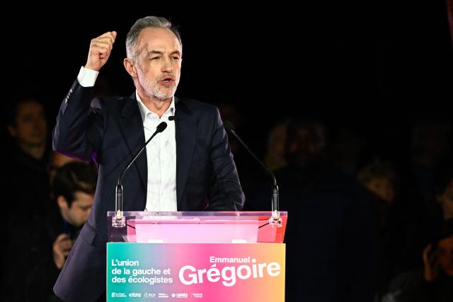 French Socialist Party (PS) Member of Parliament and left wing candidate for the Paris city hall Emmanuel Gregoire gestures as he delivers a speech during a campaign rally ahead of the second round of France's 2026 municipal elections, at the Belleville Park in Paris on March 20, 2026. French voters head to the polls on March 22, 2026, for the second round of municipal elections. (Photo by JULIEN DE ROSA / AFP)