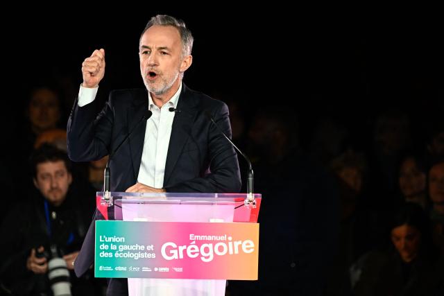 French Socialist Party (PS) Member of Parliament and left wing candidate for the Paris city hall Emmanuel Gregoire gestures as he delivers a speech during a campaign rally ahead of the second round of France's 2026 municipal elections, at the Belleville Park in Paris on March 20, 2026. French voters head to the polls on March 22, 2026, for the second round of municipal elections. (Photo by JULIEN DE ROSA / AFP)