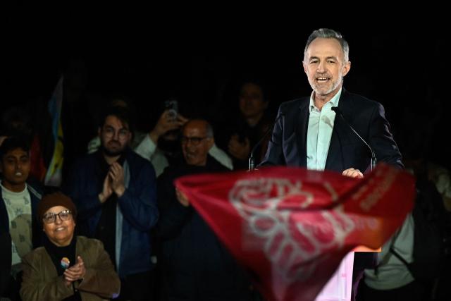 French Socialist Party (PS) Member of Parliament and left wing candidate for the Paris city hall Emmanuel Gregoire delivers a speech during a campaign rally ahead of the second round of France's 2026 municipal elections, at the Belleville Park in Paris on March 20, 2026. French voters head to the polls on March 22, 2026, for the second round of municipal elections. (Photo by JULIEN DE ROSA / AFP)