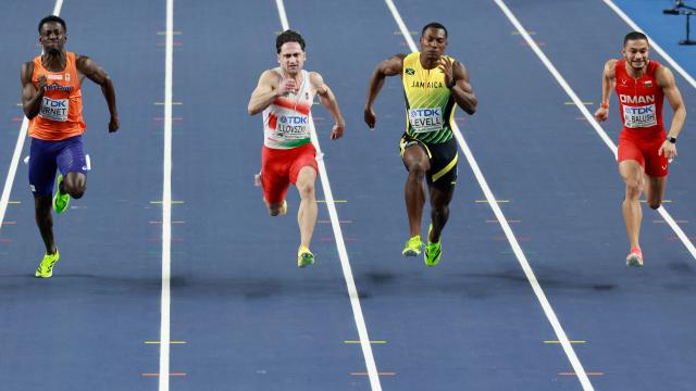 (LtoR) Netherlands' Taymir Burnet, Hungary's Dominik Illovszky, Jamaica's Bryan Levell, and Oman's Ali Al Balushi compete in the men's 60 metres semi-final heat 1 during the World Athletics Indoor Championships Kujawy Pomorze 2026 in Torun, Poland on March 20, 2026. (Photo by Wojtek RADWANSKI / AFP)