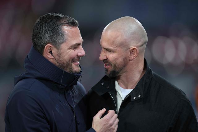 Leipzig's sporting director Marcel Schaefer (L) greets Hoffenheim's Austrian head coach Christian Ilzer prior to the German first division Bundesliga football match between RB Leipzig and TSG 1899 Hoffenheim in Leipzig, eastern Germany, on March 20, 2026. (Photo by Ronny HARTMANN / AFP) / DFL REGULATIONS PROHIBIT ANY USE OF PHOTOGRAPHS AS IMAGE SEQUENCES AND/OR QUASI-VIDEO