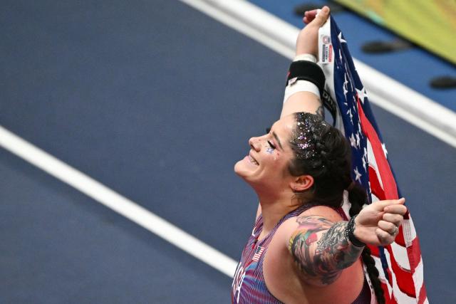 USA's Chase Jackson celebrates with her country flag winning the women's final shot put event during the World Athletics Indoor Championships Kujawy Pomorze 2026 in Torun, Poland on March 20, 2026. (Photo by Andrej ISAKOVIC / AFP)
