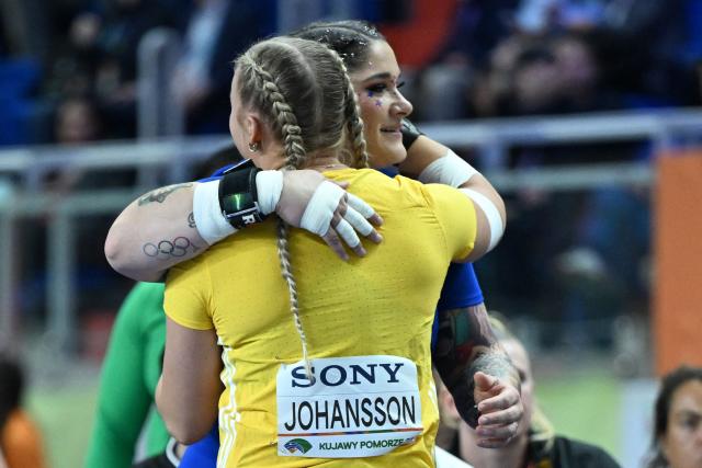 USA's Chase Jackson and Sweden's Axelina Johansson celebrate after competing in the women's final shot put event during the World Athletics Indoor Championships Kujawy Pomorze 2026 in Torun, Poland on March 20, 2026. (Photo by Kirill KUDRYAVTSEV / AFP)