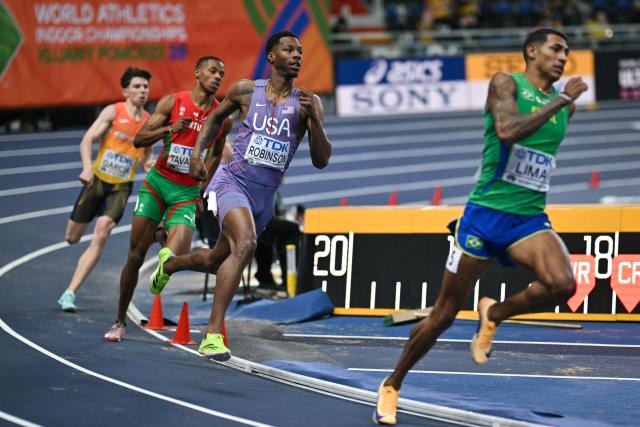USA's Chris Robinson (3rd L), Spain's David García (L), Portugal's Ericsson Tavares (2nd L) and Brazil's Matheus Lima (R),  compete in the men's 400 metres semi-final heat 1 during the World Athletics Indoor Championships Kujawy Pomorze 2026 in Torun, Poland on March 20, 2026. (Photo by Andrej ISAKOVIC / AFP)