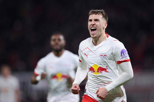 Leipzig's German midfielder #10 Brajan Gruda celebrates scoring the opening goal with his teammates during the German first division Bundesliga football match between RB Leipzig and TSG 1899 Hoffenheim in Leipzig, eastern Germany, on March 20, 2026. (Photo by Ronny HARTMANN / AFP) / DFL REGULATIONS PROHIBIT ANY USE OF PHOTOGRAPHS AS IMAGE SEQUENCES AND/OR QUASI-VIDEO