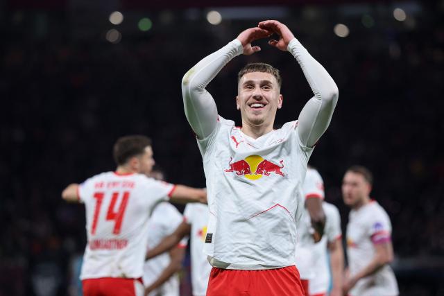 Leipzig's German midfielder #10 Brajan Gruda celebrates scoring the opening goal with his teammates during the German first division Bundesliga football match between RB Leipzig and TSG 1899 Hoffenheim in Leipzig, eastern Germany, on March 20, 2026. (Photo by Ronny HARTMANN / AFP) / DFL REGULATIONS PROHIBIT ANY USE OF PHOTOGRAPHS AS IMAGE SEQUENCES AND/OR QUASI-VIDEO