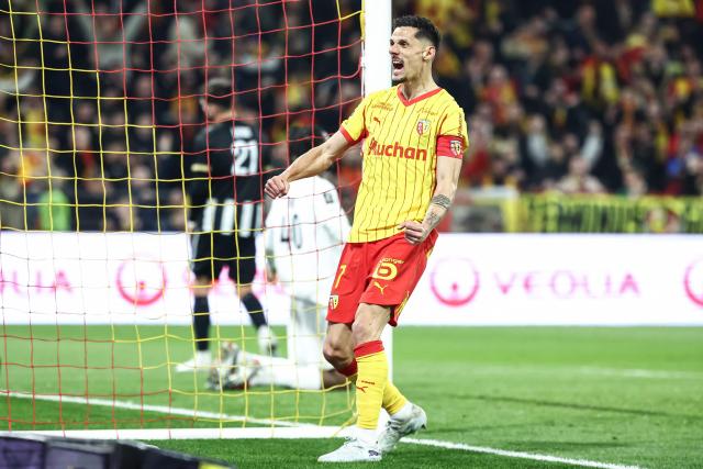 Lens' French forward #07 Florian Sotoca celebrates his team's first goal during the French L1 football match between RC Lens and SCO Angers at the Stade Bollaert-Delelis in Lens, northern France, on March 20, 2026. (Photo by Sameer Al-DOUMY / AFP)