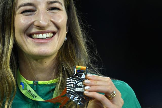 Silver medallist Australia's Nicola Olyslagers celebrates on the podium for the women's high jump event of the World Athletics Indoor Championships Kujawy Pomorze 2026 in Torun, Poland on March 20, 2026. (Photo by Kirill KUDRYAVTSEV / AFP)