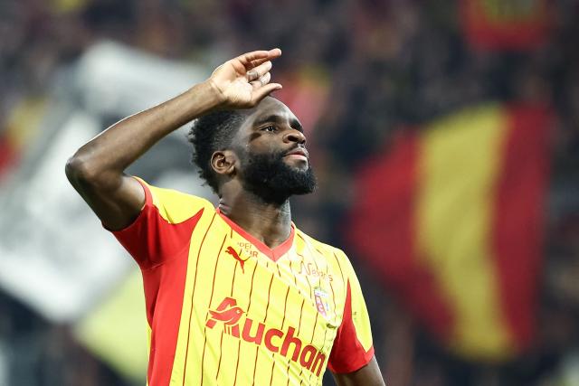 Lens' French forward #11 Odsonne Edouard celebrates scoring his team's fourth goal during the French L1 football match between RC Lens and SCO Angers at the Stade Bollaert-Delelis in Lens, northern France, on March 20, 2026. (Photo by Sameer Al-DOUMY / AFP)