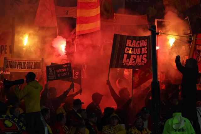 Lens' supporters cheer their team ahead of the French L1 football match between RC Lens and SCO Angers at the Stade Bollaert-Delelis in Lens, northern France, on March 20, 2026. (Photo by Sameer Al-DOUMY / AFP)