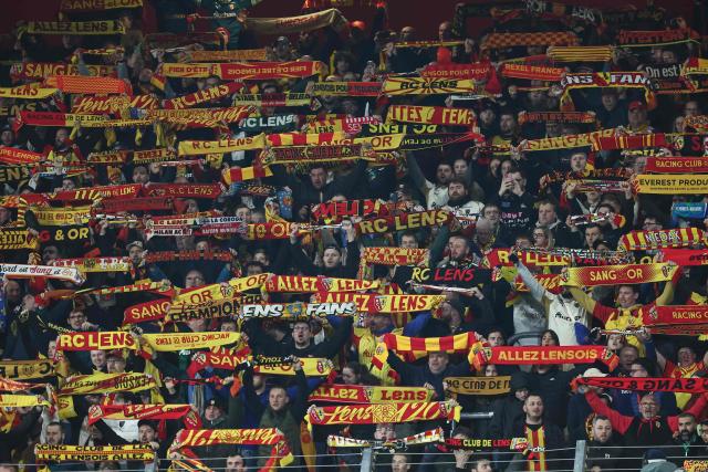 Lens' supporters cheer their team ahead of the French L1 football match between RC Lens and SCO Angers at the Stade Bollaert-Delelis in Lens, northern France, on March 20, 2026. (Photo by Sameer Al-DOUMY / AFP)