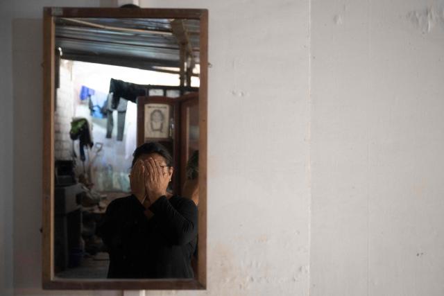 (FILES) Cristina Yachachin, 70, poses for a picture during an interview at her house in Pamplona, on the outskirts of Lima on May 16, 2025. Prisons surrounded by snakes, rewards for killing criminals, annihilation squads: in Peru, candidates in the April 12, 2026 presidential election are competing with proposals to curb rampant crime, marked by the rise of contract killings and extortion. (Photo by Ernesto BENAVIDES / AFP)