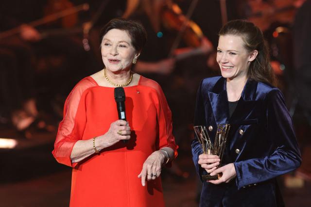 French percussionist Adelaide Ferriere (R) receives the Instrumental Soloist of the Year award from French actress Macha Méril during the Victoires de la Musique Classique 2026 music awards ceremony at Le Quartz theatre in Brest March 20, 2026. (Photo by FRED TANNEAU / AFP)