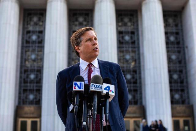 Plaintiffs' attorney Mark Lanier speaks with the media outside Los Angeles Superior Court at the US Court House as the jury continue deliberations in the social media trial tasked to determine whether social media giants deliberately designed their platforms to be addictive to children, in Los Angeles, on March 20, 2026. (Photo by Apu GOMES / AFP)