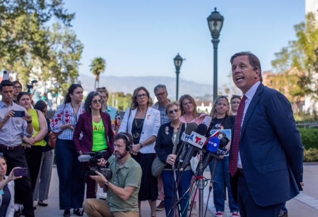 Plaintiffs' attorney Mark Lanier speaks with the media outside Los Angeles Superior Court at the US Court House as the jury continue deliberations in the social media trial tasked to determine whether social media giants deliberately designed their platforms to be addictive to children, in Los Angeles, on March 20, 2026. (Photo by Apu GOMES / AFP)