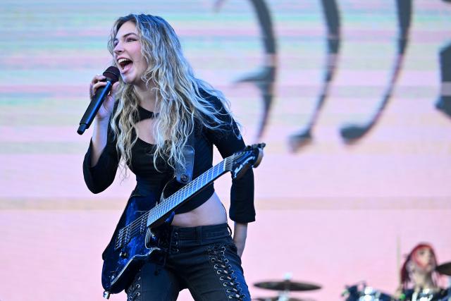 Mexican musician Daniela Villarreal, from the rock band The Warning, performs on stage during the first day of the Estereo Picnic music festival at the Simon Bolivar park in Bogota on March 20, 2026. (Photo by Alejandro GONZALEZ / AFP)
