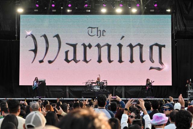 Mexican rock band The Warning performs on stage during the first day of the Estereo Picnic music festival at the Simon Bolivar park in Bogota on March 20, 2026. (Photo by Alejandro GONZALEZ / AFP)