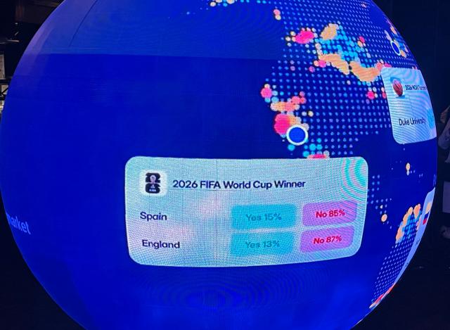 A LED sphere screen shows information inside the new location of the prediction market online platform Polymarket called "The Situation Room", during its opening day in Washington, DC, on March 20, 2026. Prediction market platforms have rapidly broken into the mainstream in the United States, positioning themselves as an alternative to both traditional polling and licensed sports betting. Platforms like Polymarket and its biggest rival Kalshi, remain illegal or unregulated in most countries outside the US, where regulators have generally classified them as unlicensed gambling. (Photo by Théo MARIE-COURTOIS / AFP)
