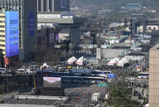 This general view shows the stage (R top) for the comeback concert of K-pop boy group BTS at Gwanghwamun Square in downtown Seoul on March 21, 2026. South Korean megastars BTS reunite on March 21, for their first show in nearly four years, with an expected 260,000 fans taking over central Seoul for a K-pop extravaganza livestreamed to millions more worldwide. (Photo by Jung Yeon-je / AFP)