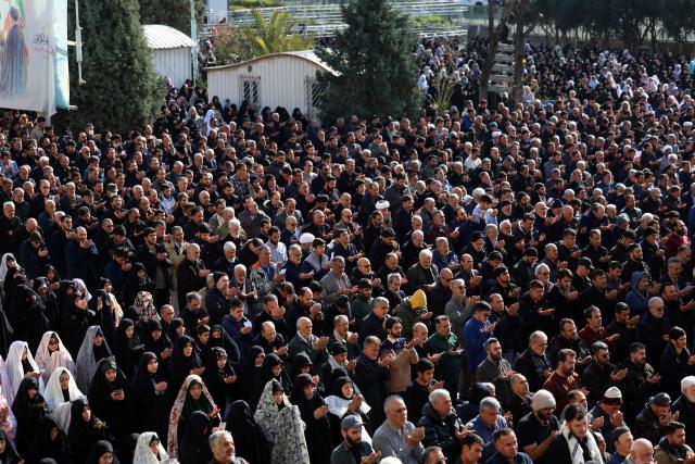 Iranian Shias take part in Eid al-Fitr prayers, marking the end of the Muslim holy month of Ramadan, at the Grand Mosalla mosque in Tehran on March 21, 2026. The Iranian capital has come under near-daily bombardment since a joint US-Israeli attack started the war on February 28, killing top officials, including the Islamic republic's supreme leader. (Photo by AFP)