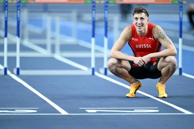 Switzerland's Simon Ehammer reacts after finishing first in the men's heptathlon 60 metres hurdles heat 2 during the World Athletics Indoor Championships Kujawy Pomorze 2026 in Torun, Poland on March 21, 2026. (Photo by Kirill KUDRYAVTSEV / AFP)