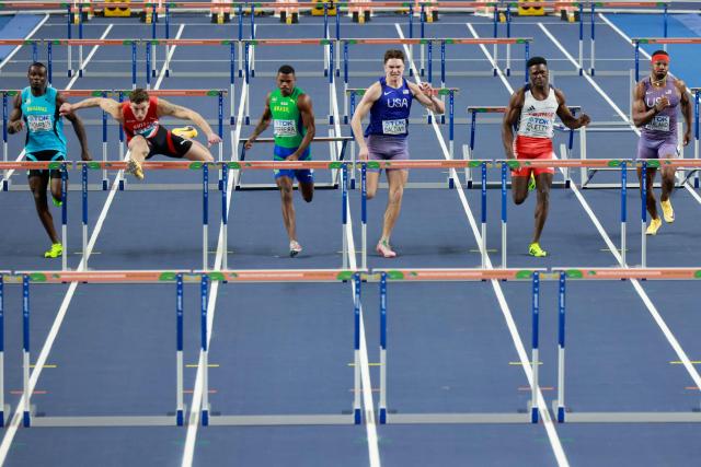Bahamas' Kendrick Thompson (L), Switzerland's Simon Ehammer, Brazil's Jose Fernando Ferreira, USA's Heath Baldwin, France's Makenson Gletty and USA's Kyle Garland compete in the men's heptathlon 60 metres hurdles heat 2 during the World Athletics Indoor Championships Kujawy Pomorze 2026 in Torun, Poland on March 21, 2026. (Photo by Wojtek RADWANSKI / AFP)