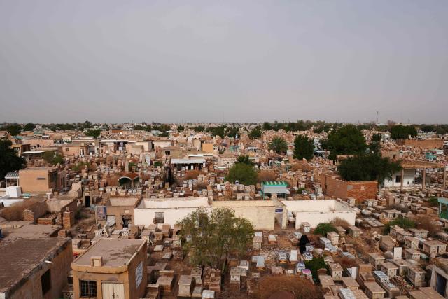 A general view shows Wadi al-Salam Cemetery in Iraq's central holy city of Najaf on March 21, 2026. Iraq has been unwillingly drawn into the regional conflict triggered by the US-Israel attack on its neighbour Iran on February 28. Strikes have targeted Iran-backed groups, which in turn have claimed near-daily attacks on US interests, mostly in Iraq but also across the wider region. (Photo by Qassem al-KAABI / AFP)