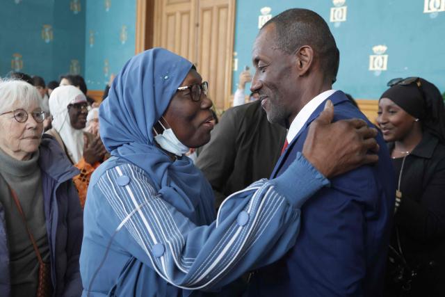 Saint-Denis Mayor Bally Bagayoko (R) is congratulated by his mother ahead of the first session of the newly-elected city council in Saint-Denis, suburb of Paris, on March 21, 2026. (Photo by Ludovic MARIN / AFP)