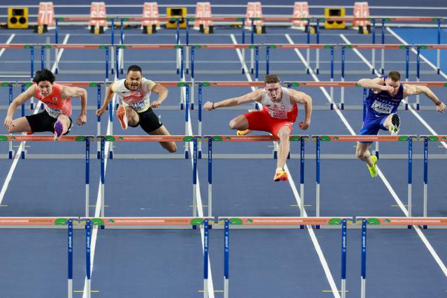 Japan's Shusei Nomoto (L), Belgium's Michael Obasuyi, Poland's Jakub Szymanski and Finland's Elmo Lakka compete in the men's 60 metres hurdles heat 5 during the World Athletics Indoor Championships Kujawy Pomorze 2026 in Torun, Poland on March 21, 2026. (Photo by Wojtek RADWANSKI / AFP)