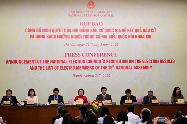 Nguyen Thi Thanh (4th L), Permanent Vice Chairwoman of the National Election Council, attends a press conference announcing the results of the National Assembly and People's Council elections, at the National Assembly Building in Hanoi on March 21, 2026. (Photo by Nhac NGUYEN / AFP)