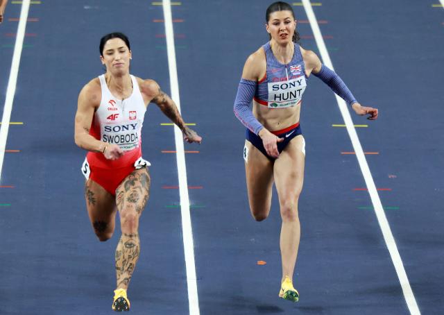 Poland's Ewa Swoboda (L) and Britain's Amy Hunt compete in the women's 60 metres heat 7 during the World Athletics Indoor Championships Kujawy Pomorze 2026 in Torun, Poland on March 21, 2026. (Photo by Wojtek RADWANSKI / AFP)