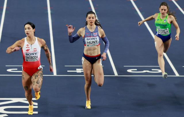 Poland's Ewa Swoboda (L), Britain's Amy Hunt and Slovenia's Lucija Potnik compete in the women's 60 metres heat 7 during the World Athletics Indoor Championships Kujawy Pomorze 2026 in Torun, Poland on March 21, 2026. (Photo by Wojtek RADWANSKI / AFP)