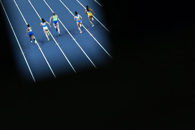 Athletes compete in the women's 60 metres heat 3 during the World Athletics Indoor Championships Kujawy Pomorze 2026 in Torun, Poland on March 21, 2026. (Photo by Kirill KUDRYAVTSEV / AFP)