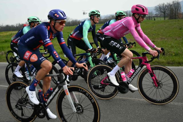 EF Education - EasyPost's Danish rider Kasper Asgreen (R) rides with NSN's New Zealander rider Dion Allan Smith (117), Decathlon's rider Tobias Lund Andresen (C) during the Milan - Sanremo one-day classic cycling race near Voghera, on March 21, 2026. (Photo by Marco BERTORELLO / AFP)