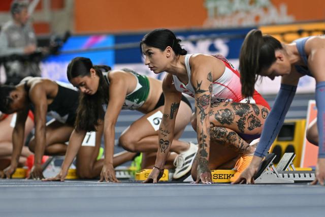 Trinidad and Tobago's Leah Bertrand (L), Cook Islands' Estelle Short, Poland's Ewa Swoboda and Britain's Amy Hunt prepare to compete in the women's 60 metres heat 7 during the World Athletics Indoor Championships Kujawy Pomorze 2026 in Torun, Poland on March 21, 2026. (Photo by Andrej ISAKOVIC / AFP)