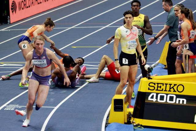 Netherlands' Keenan Blake is seen on the floor after a handover in the 4 x 400m relay final during the World Athletics Indoor Championships Kujawy Pomorze 2026 in Torun, Poland on March 21, 2026. (Photo by Wojtek RADWANSKI / AFP)