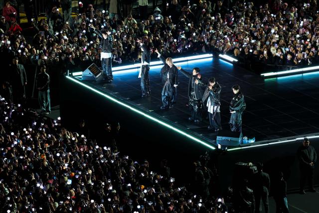 K-pop boy group BTS perform during their concert at Gwanghwamun Square in Seoul on March 21, 2026. South Korean megastars BTS reunite on March 21, for their first show in nearly four years, with an expected 260,000 fans taking over central Seoul for a K-pop extravaganza livestreamed to millions more worldwide. (Photo by Kim Hong-Ji / POOL / AFP)