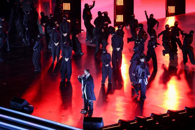 K-pop boy group BTS perform during their concert at Gwanghwamun Square in Seoul on March 21, 2026. South Korean megastars BTS reunite on March 21, for their first show in nearly four years, with an expected 260,000 fans taking over central Seoul for a K-pop extravaganza livestreamed to millions more worldwide. (Photo by Kim Hong-Ji / POOL / AFP)