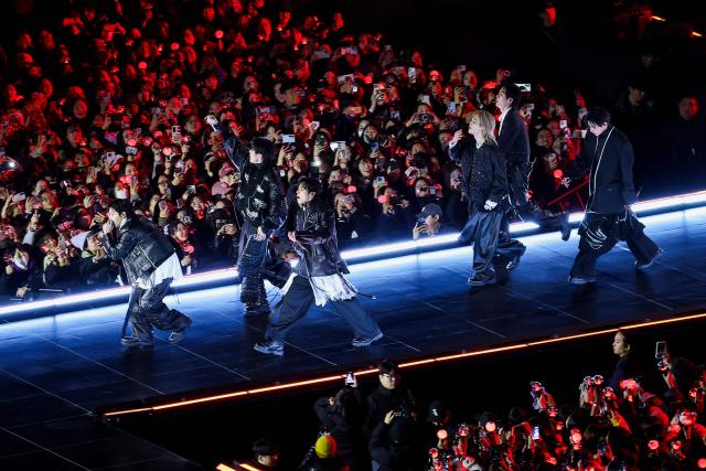 K-pop boy group BTS perform during their concert at Gwanghwamun Square in Seoul on March 21, 2026. South Korean megastars BTS reunited on March 21 for their first show in nearly four years, blowing away enormous crowds in Seoul for a K-pop extravaganza livestreamed to millions more worldwide. (Photo by Kim Hong-Ji / POOL / AFP)