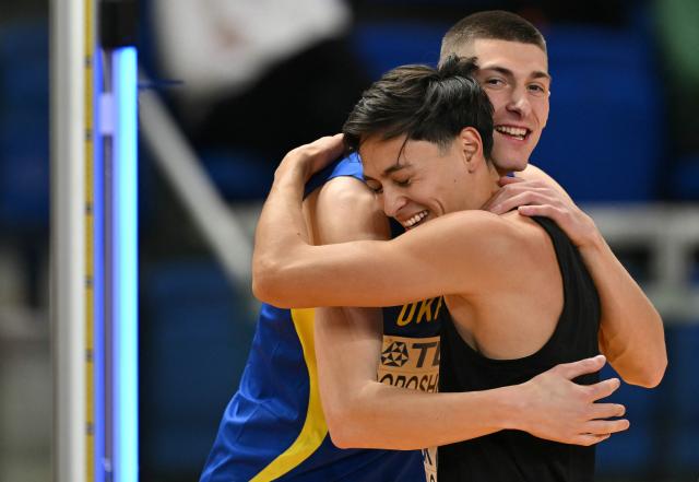 Mexico's Erick Portillo (R) and Ukraine's Oleh Doroshchuk celebrate in the Men's High Jump final during the World Athletics Indoor Championships Kujawy Pomorze 2026 in Torun, Poland on March 21, 2026. (Photo by Andrej ISAKOVIC / AFP)