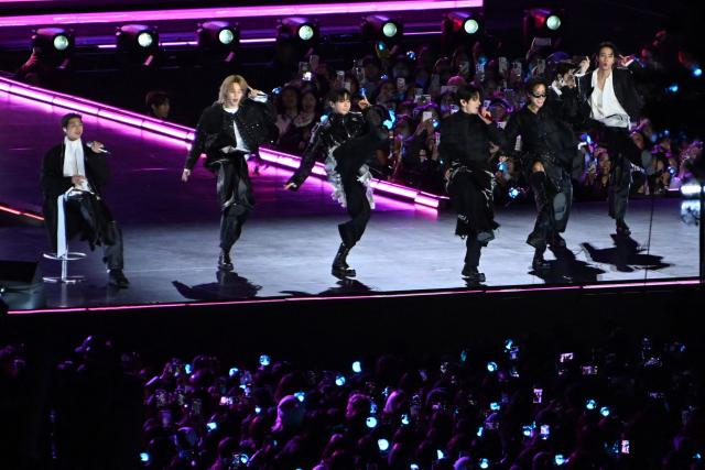 K-pop boy group BTS perform during their concert at Gwanghwamun Square in Seoul on March 21, 2026. South Korean megastars BTS reunite on March 21, for their first show in nearly four years, with an expected 260,000 fans taking over central Seoul for a K-pop extravaganza livestreamed to millions more worldwide. (Photo by KIM Min-Hee / POOL / AFP)