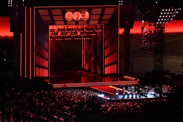 K-pop boy group BTS perform during their concert at Gwanghwamun Square in Seoul on March 21, 2026. South Korean megastars BTS reunite on March 21, for their first show in nearly four years, with an expected 260,000 fans taking over central Seoul for a K-pop extravaganza livestreamed to millions more worldwide. (Photo by KIM Min-Hee / POOL / AFP)